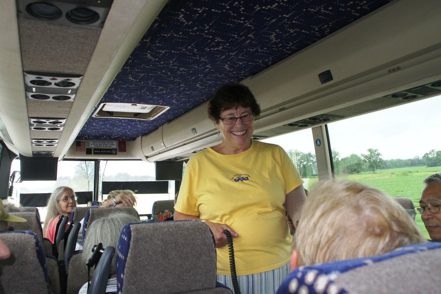 Tour coordinator Molly Schneider socializing on the bus
