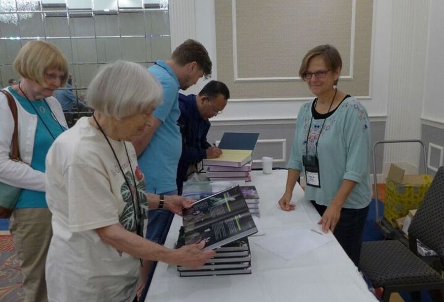 Mary Jo Modica helping with the China book sales